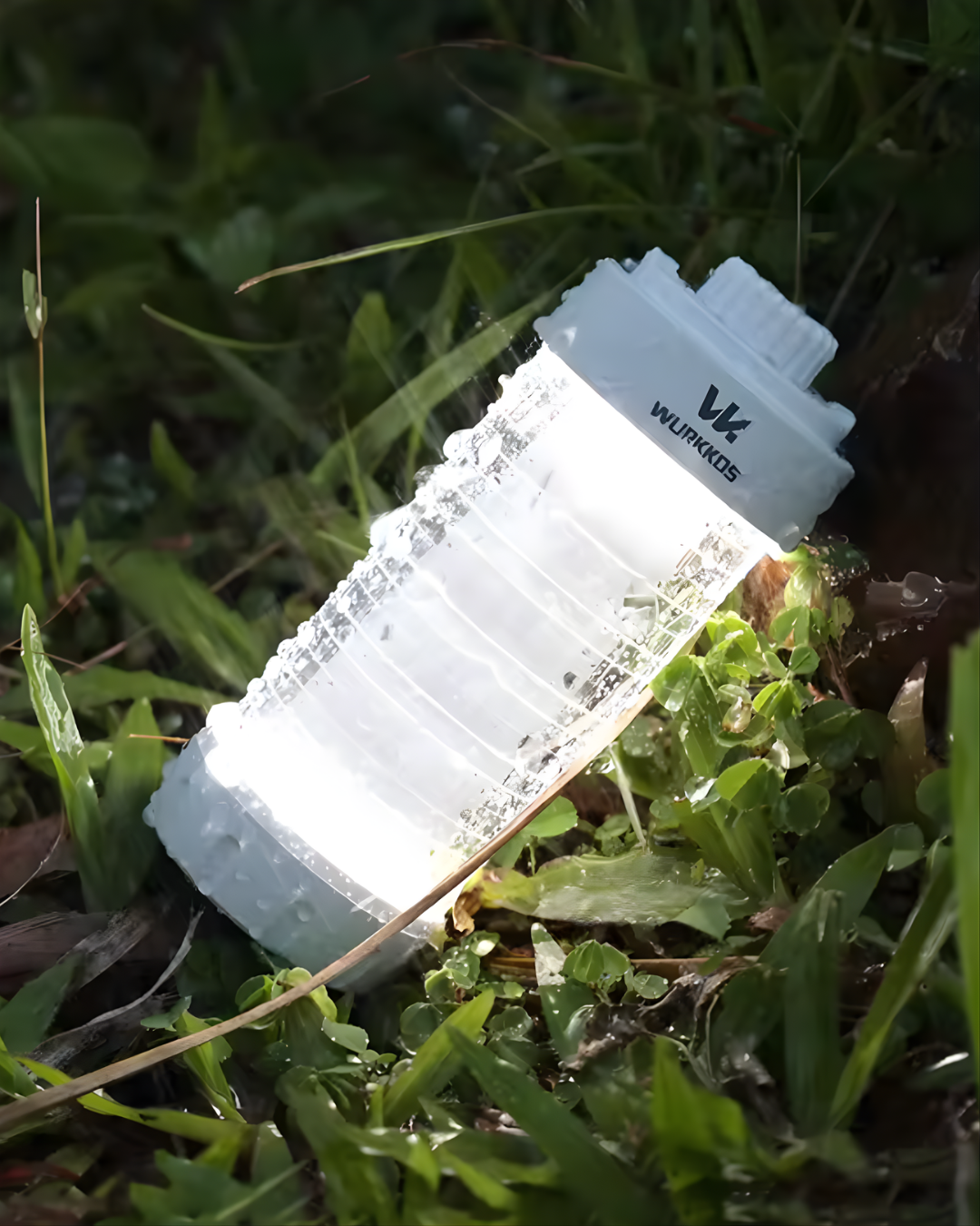 Wurkkos CL01 Magnetic Camp Lantern on grass during rain storm