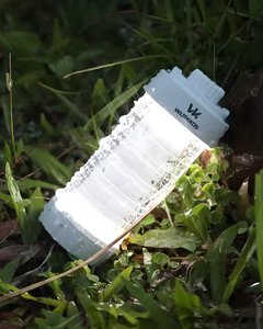 Wurkkos CL01 Magnetic Camp Lantern on grass during rain storm